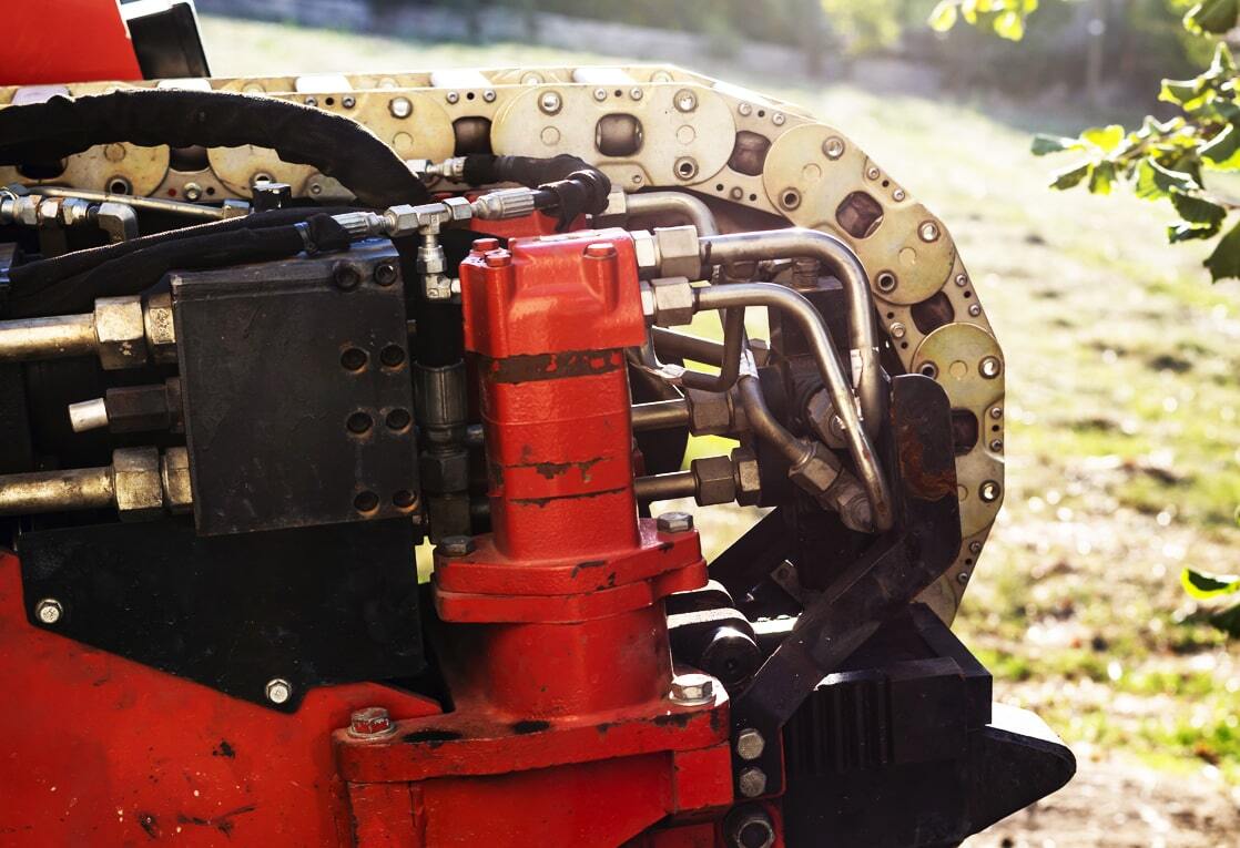 This is a digital art image of a hand holding a blueprint with a background of power lines and a blue sky. The image has a futuristic feel with various icons and symbols floating around the hand and blueprint. The icons and symbols include a person, a gear, a water droplet, a wifi symbol, and a light bulb. The image has a blue color scheme.