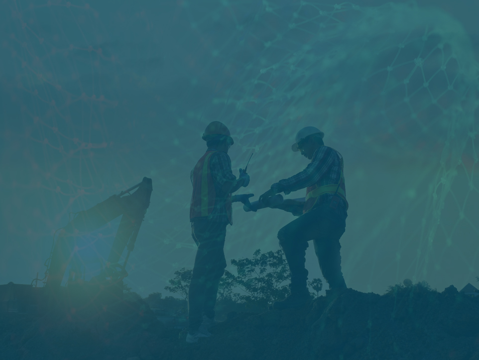 Two construction workers on a construction site with a blue overlay. One worker is holding a clipboard and the other is pointing at something. There is a large excavator in the background.