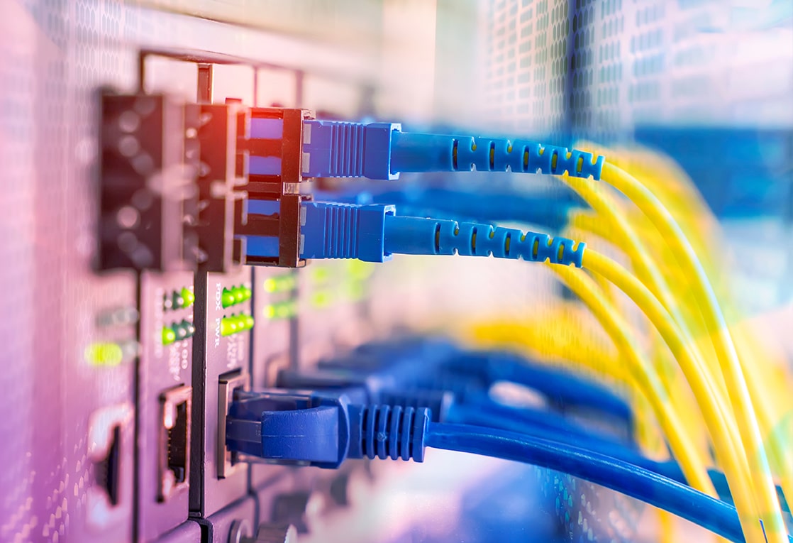 Network cables plugged in with green lights. 