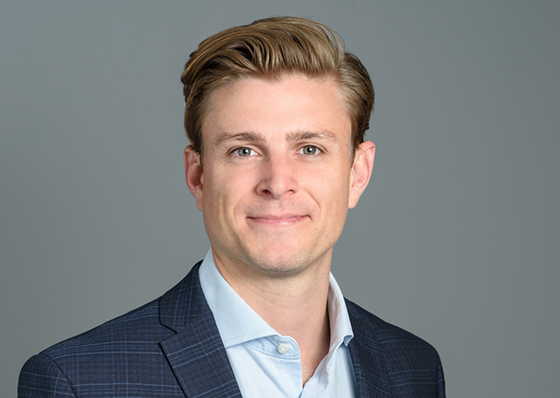 A man, Stephen Weatherford,  in a blue suit jacket and a white collared shirt.